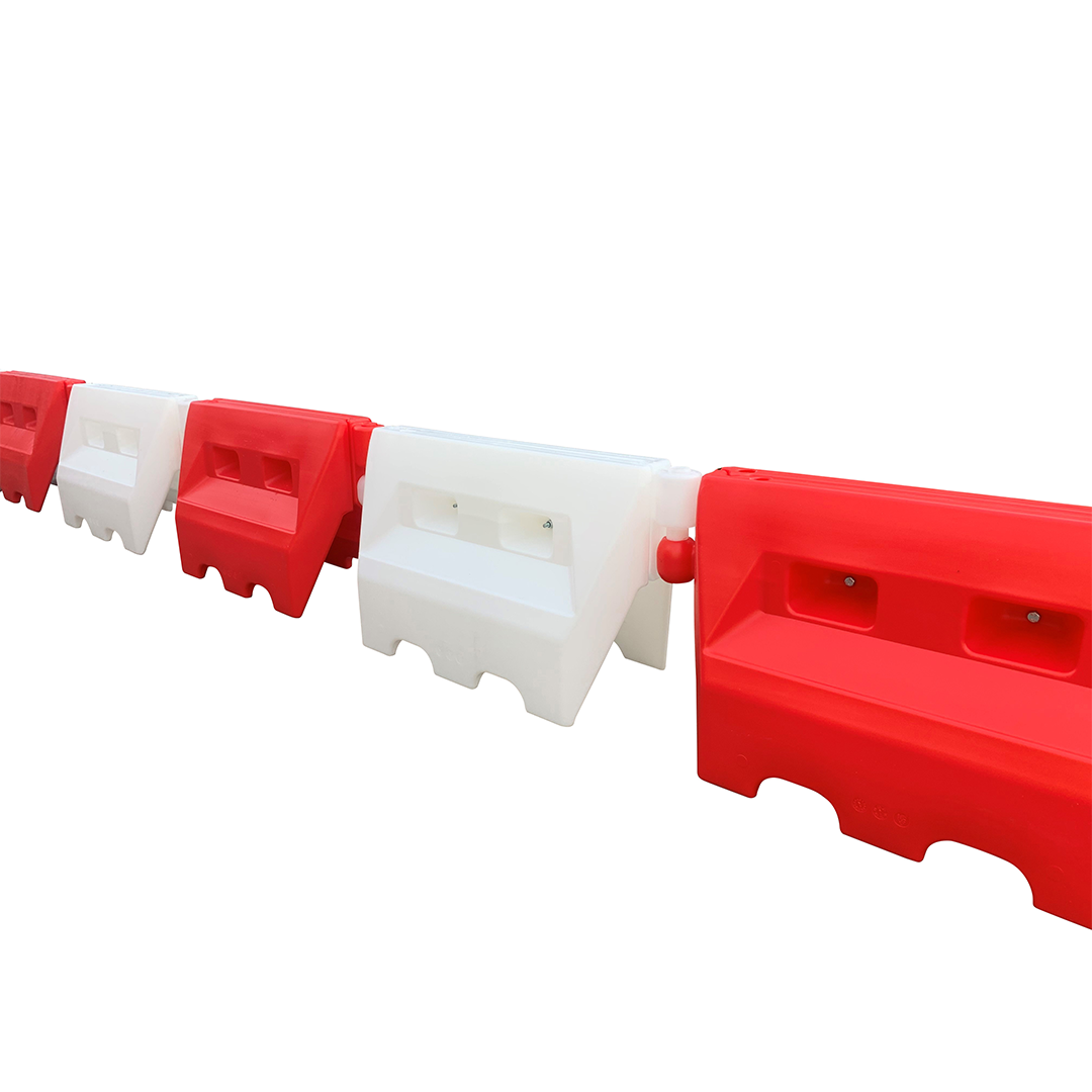 Side view of connected traffic separators on a white background