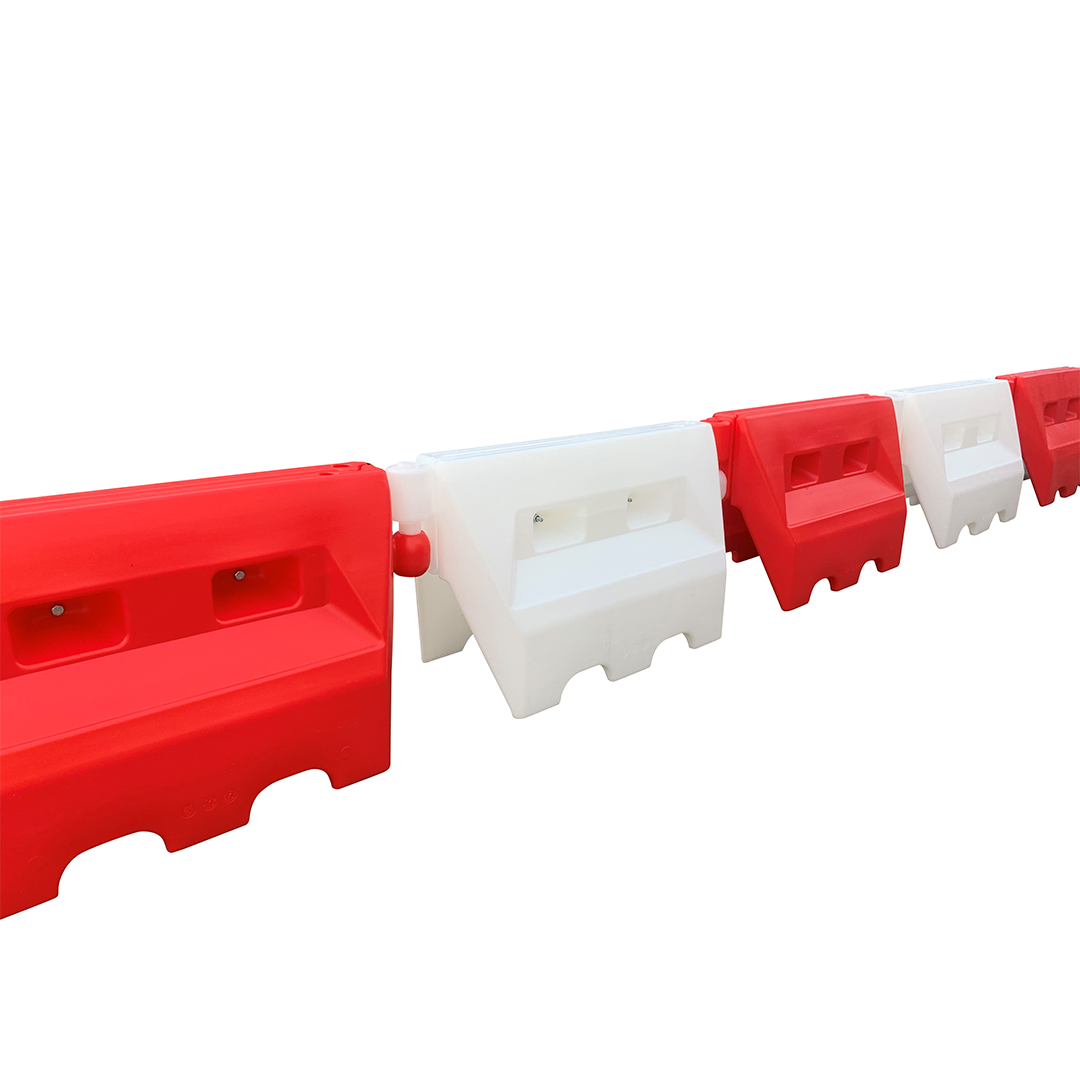 Side view of connected traffic separators on a white background